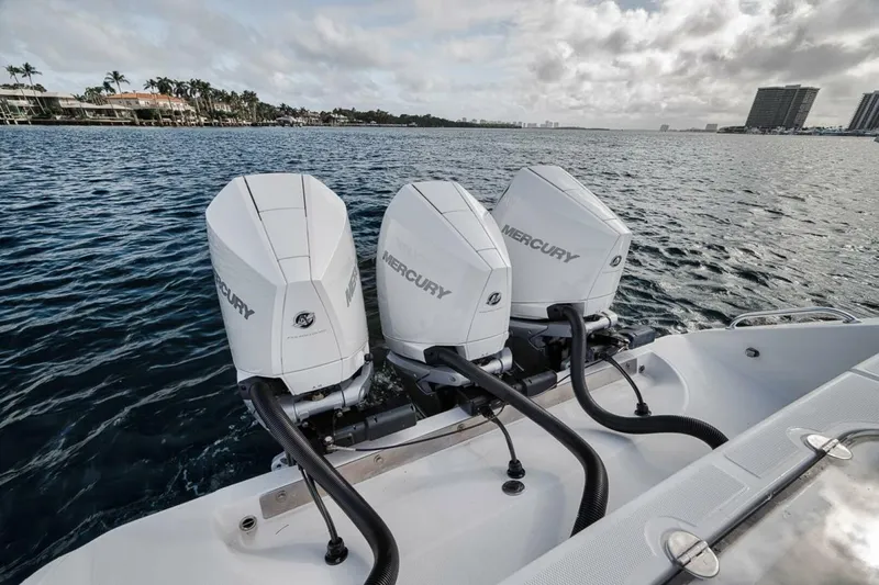 Southpaw Yacht Photos Pics 2015 Bahama 41' boat with triple Mercury outboard engines on the water.