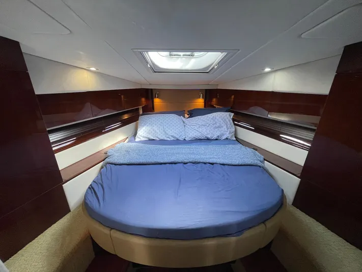  Yacht Photos Pics Luxurious cabin interior of 2010 Sea Ray 450 Sundancer yacht with cozy bedding.