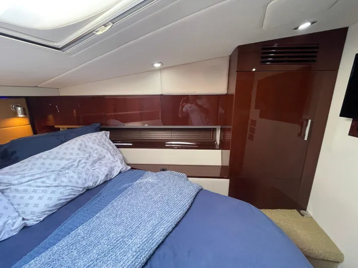  Yacht Photos Pics Luxurious cabin interior of 2010 Sea Ray 450 Sundancer yacht with cozy bedding.