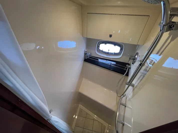  Yacht Photos Pics Luxurious bathroom in 2010 Sea Ray 450 Sundancer yacht with shower and window.