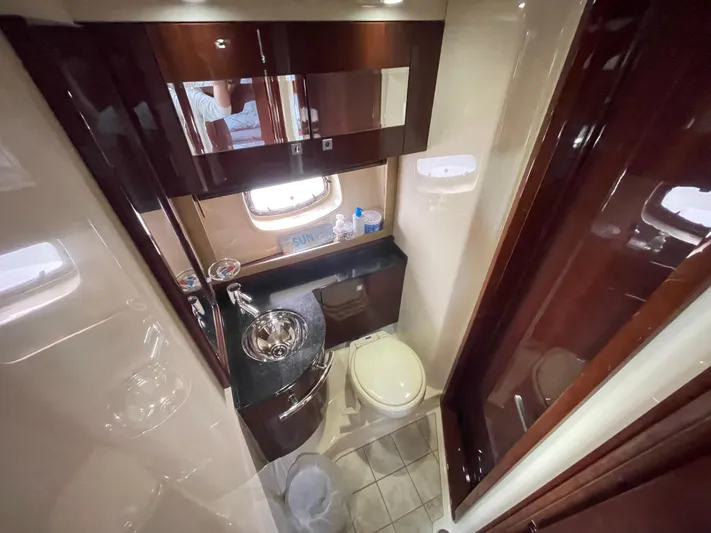  Yacht Photos Pics Luxurious bathroom interior of 2010 Sea Ray 450 Sundancer yacht with modern fixtures.