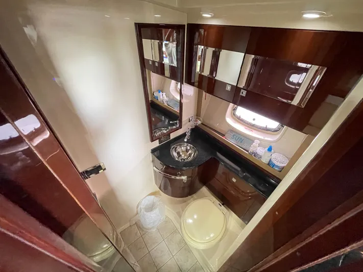  Yacht Photos Pics Luxurious bathroom interior of 2010 Sea Ray 450 Sundancer yacht with modern fixtures.