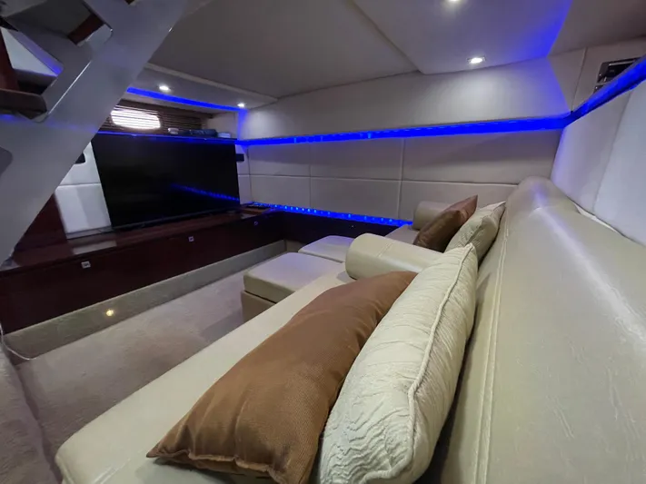  Yacht Photos Pics Luxurious interior of 2010 Sea Ray 450 Sundancer with modern seating and ambient lighting.