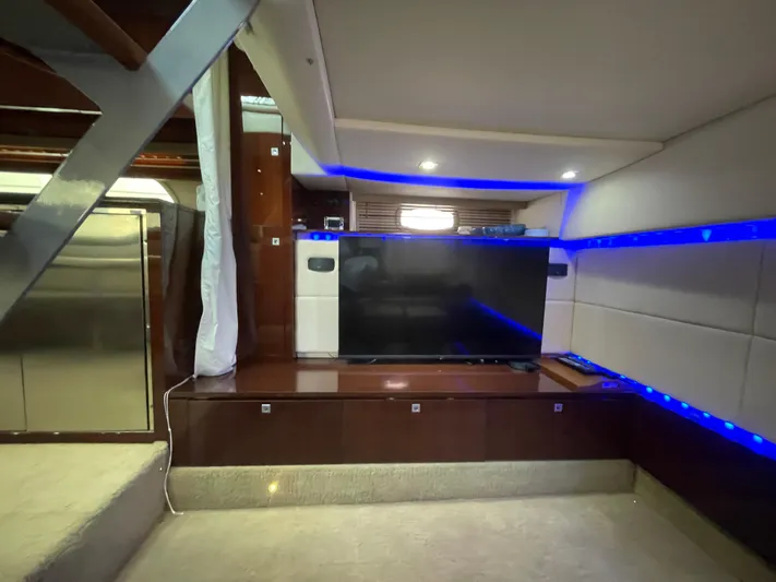  Yacht Photos Pics Luxurious interior of 2010 Sea Ray 450 Sundancer yacht with modern TV and ambient lighting.