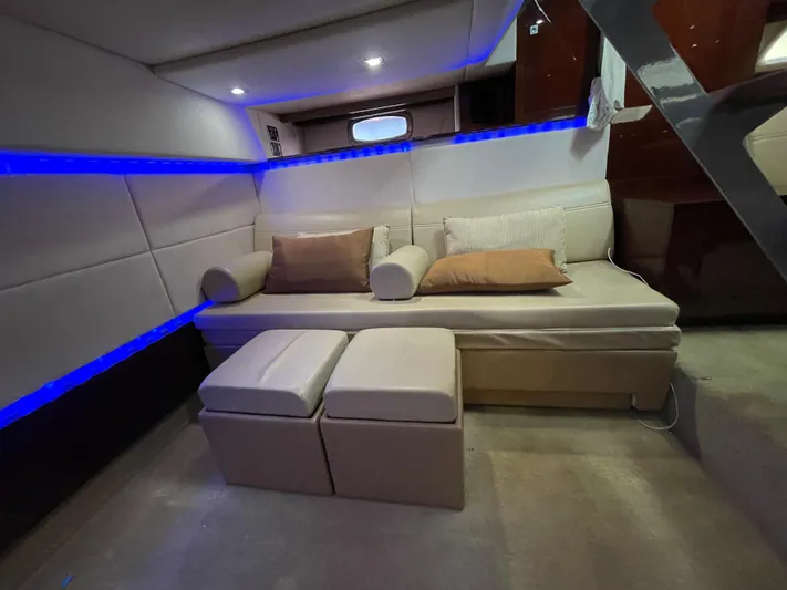  Yacht Photos Pics Luxurious interior of 2010 Sea Ray 450 Sundancer yacht with modern seating and ambient lighting.