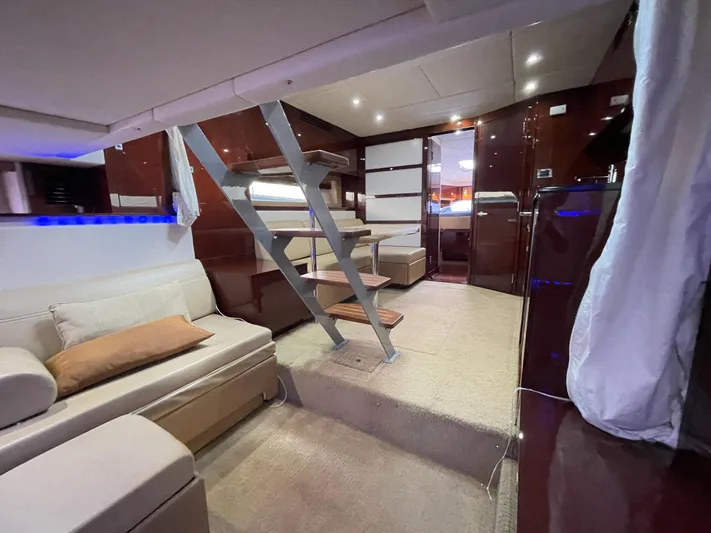  Yacht Photos Pics Luxurious interior of 2010 Sea Ray 450 Sundancer yacht with modern seating and staircase.