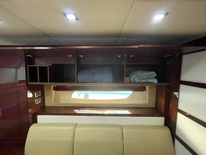  Yacht Photos Pics Interior of 2010 Sea Ray 450 Sundancer with storage cabinets and window.