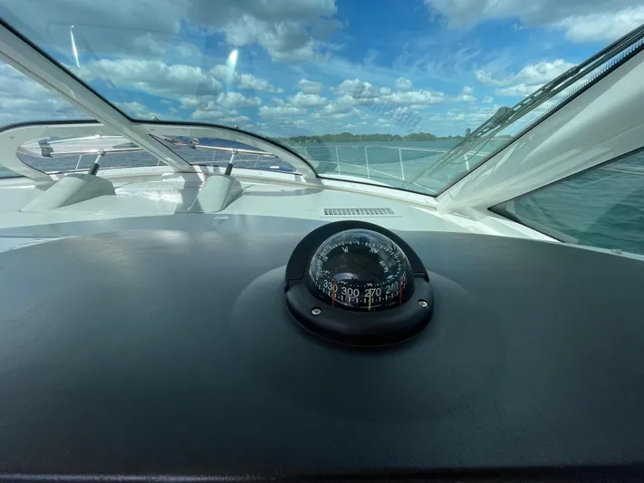  Yacht Photos Pics Compass view from 2010 Sea Ray 450 Sundancer, under a partly cloudy sky.