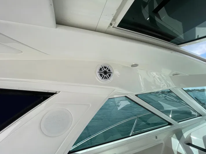  Yacht Photos Pics 2010 Sea Ray 450 Sundancer boat interior with speaker and windows, showcasing sleek design.