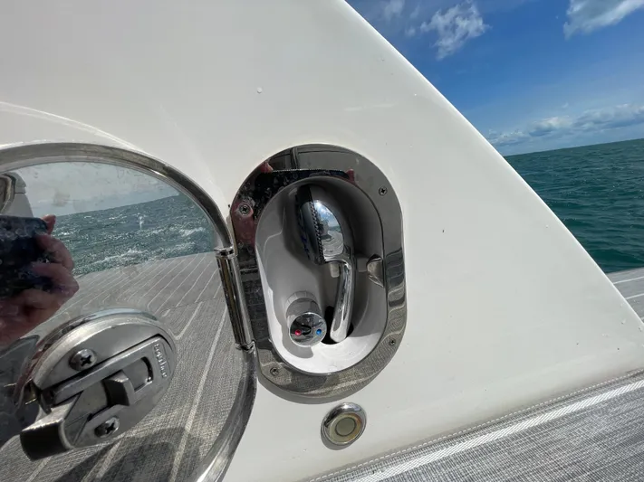  Yacht Photos Pics Close-up of a 2010 Sea Ray 450 Sundancer boat's deck hardware with ocean view.