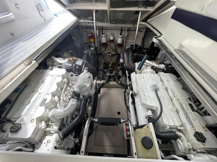  Yacht Photos Pics Engine room of a 2010 Sea Ray 450 Sundancer, showcasing dual engines and mechanical components.