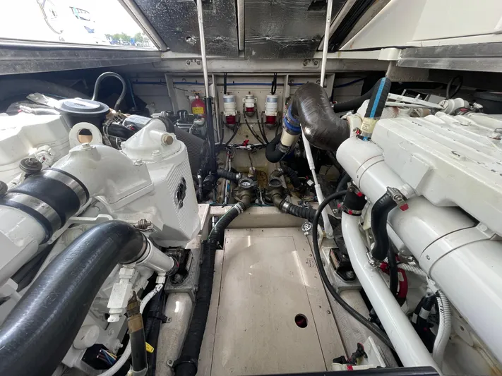  Yacht Photos Pics Engine room of a 2010 Sea Ray 450 Sundancer, showcasing mechanical components and systems.
