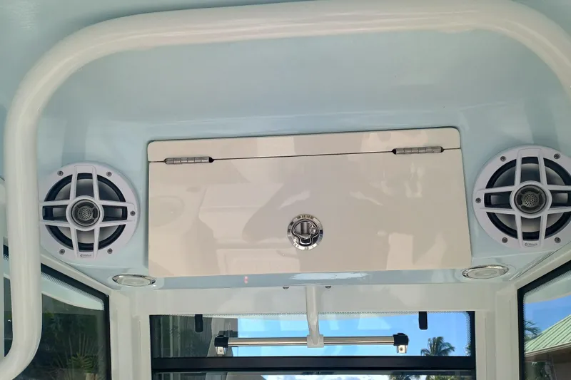 250-118 Yacht Photos Pics 2026 Robalo R250 Center Console boat interior with speakers and storage compartment.