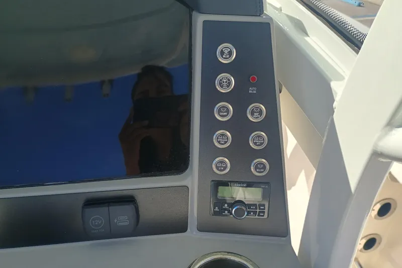 250-118 Yacht Photos Pics Control panel of 2026 Robalo R250 Center Console boat with various buttons and display.