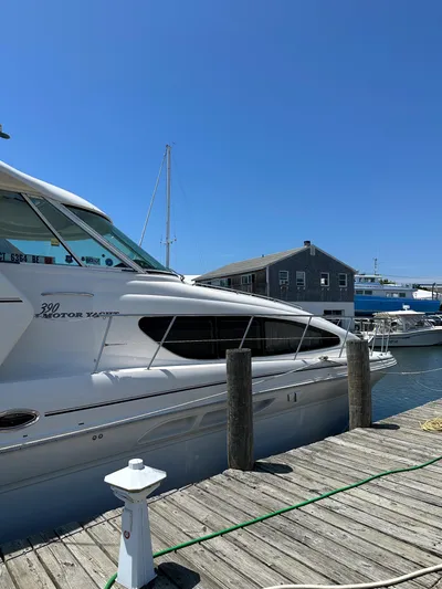 "gina Maria" Yacht Photos Pics 2005 Sea Ray 390 Motor Yacht docked at a marina on a sunny day.