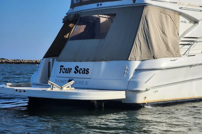 Four Seas Yacht Photos Pics 2001 Sea Ray 400 Sedan Bridge yacht named "Four Seas" in calm waters.