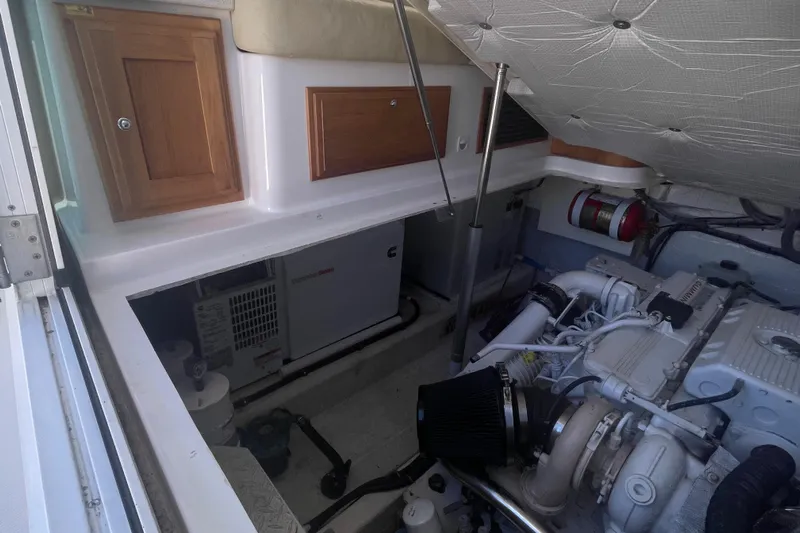 Selah Yacht Photos Pics Engine room of 2012 Back Cove 37 boat with visible machinery and storage compartments.
