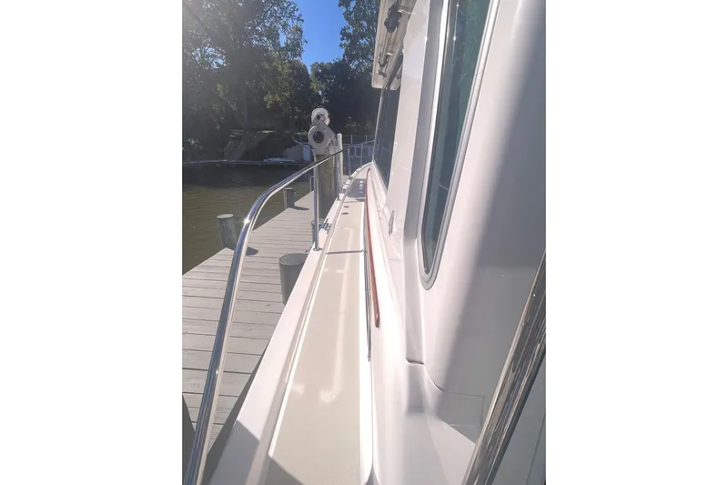 Selah Yacht Photos Pics 2012 Back Cove 37 yacht docked, showcasing sleek side deck and railing.