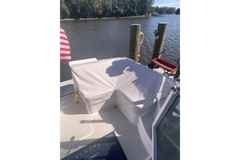 Selah Yacht Photos Pics 2012 Back Cove 37 boat docked by a serene river with covered seating.