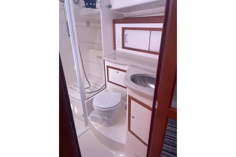 Selah Yacht Photos Pics 2012 Back Cove 37 yacht bathroom with shower, sink, and toilet.