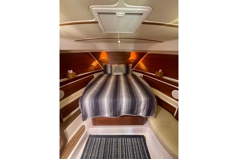 Selah Yacht Photos Pics Luxurious cabin interior of 2012 Back Cove 37 yacht with striped bedding.