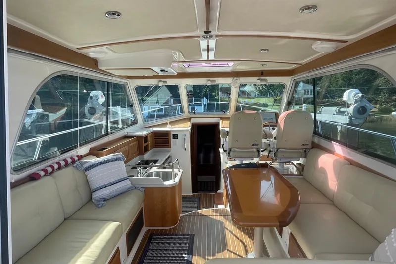 Selah Yacht Photos Pics Luxurious interior of a 2012 Back Cove 37 yacht with plush seating and elegant wood finishes.