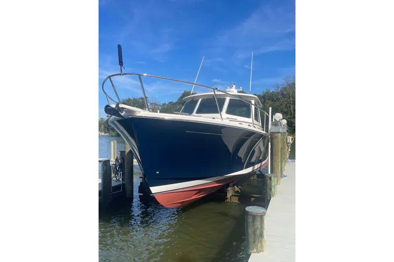 Selah Yacht Photos Pics 2012 Back Cove 37 boat docked, featuring a sleek blue hull and white deck.