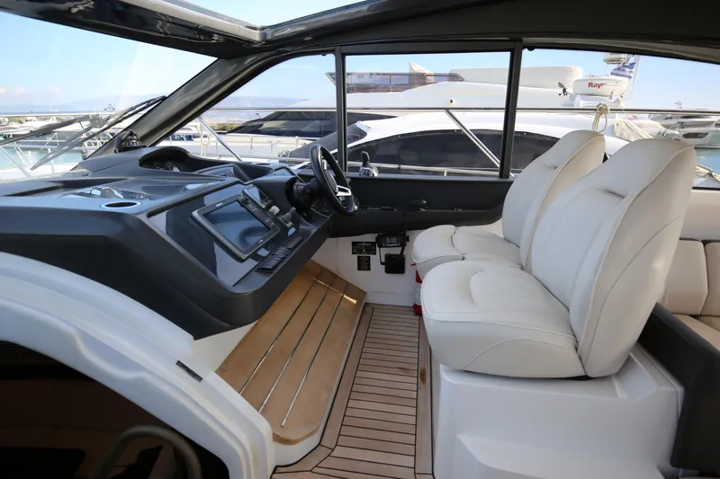  Yacht Photos Pics 2015 Princess V48 yacht interior with modern helm and luxurious seating.