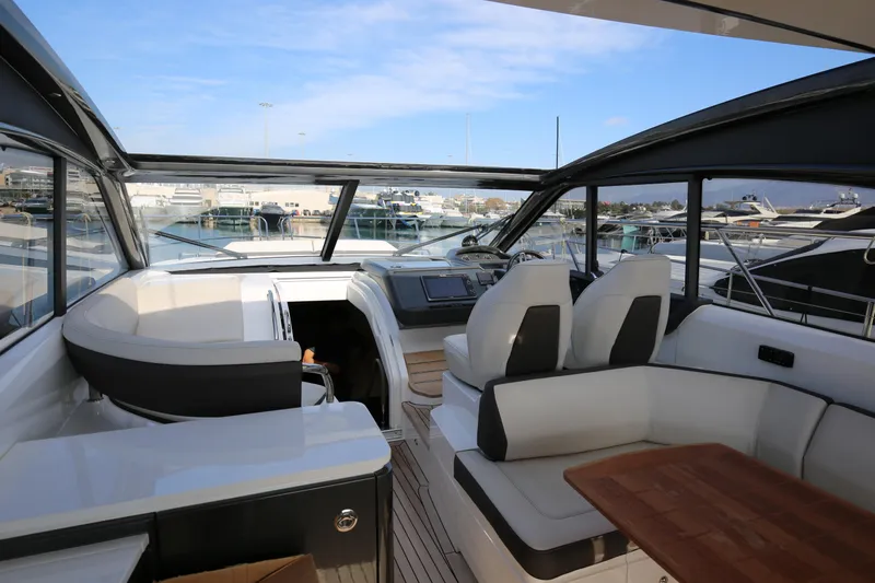  Yacht Photos Pics Luxurious 2015 Princess V48 yacht interior with modern seating and panoramic windows.