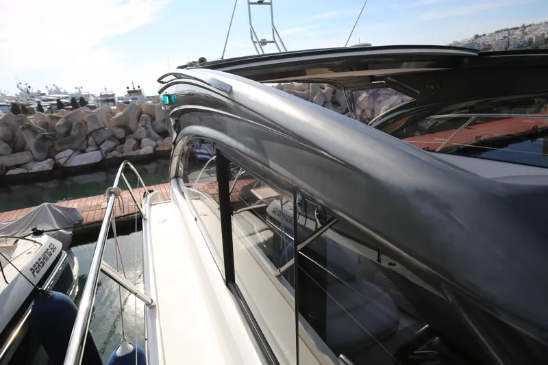 Yacht Photos Pics 2015 Princess V48 yacht docked at marina, showcasing sleek design and modern features.