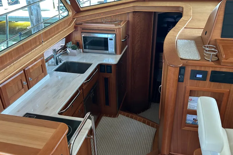  Yacht Photos Pics Luxurious interior of 2022 Sabre 45 Salon Express yacht with modern kitchen amenities.