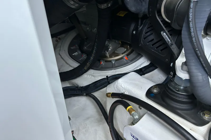  Yacht Photos Pics Engine compartment of 2022 Sabre 45 Salon Express with visible hoses and components.