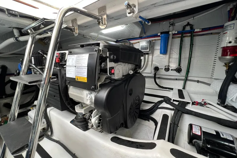  Yacht Photos Pics Engine room of 2022 Sabre 45 Salon Express with visible generator and piping.