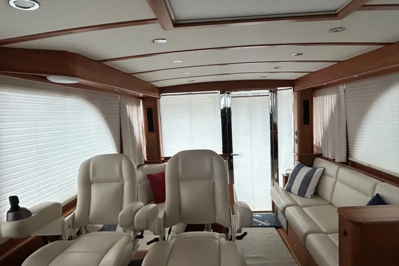  Yacht Photos Pics Luxurious interior of 2022 Sabre 45 Salon Express yacht with plush seating and elegant design.