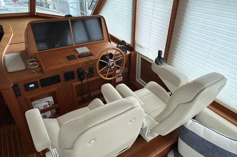  Yacht Photos Pics Interior helm of 2022 Sabre 45 Salon Express with dual seats and navigation controls.