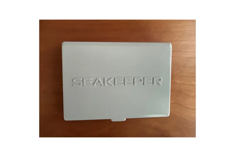  Yacht Photos Pics Seakeeper control panel on Sabre 45 Salon Express 2022 yacht, wooden background.