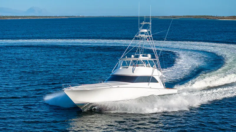 First Bite Yacht Photos Pics Viking 2005 yacht cruising on open water, creating a dynamic wake.