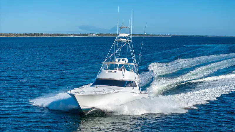 First Bite Yacht Photos Pics Viking 2005 yacht cruising on open water, 2004 model, creating a dynamic wake.