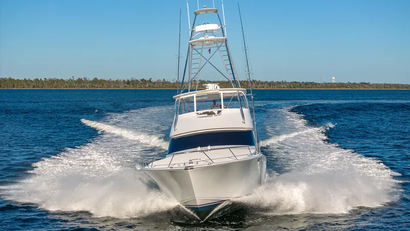 First Bite Yacht Photos Pics Viking 2005 yacht cruising on open water, creating a dynamic wake.