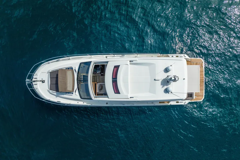  Yacht Photos Pics Aerial view of 2018 Prestige 520S yacht on clear blue water.