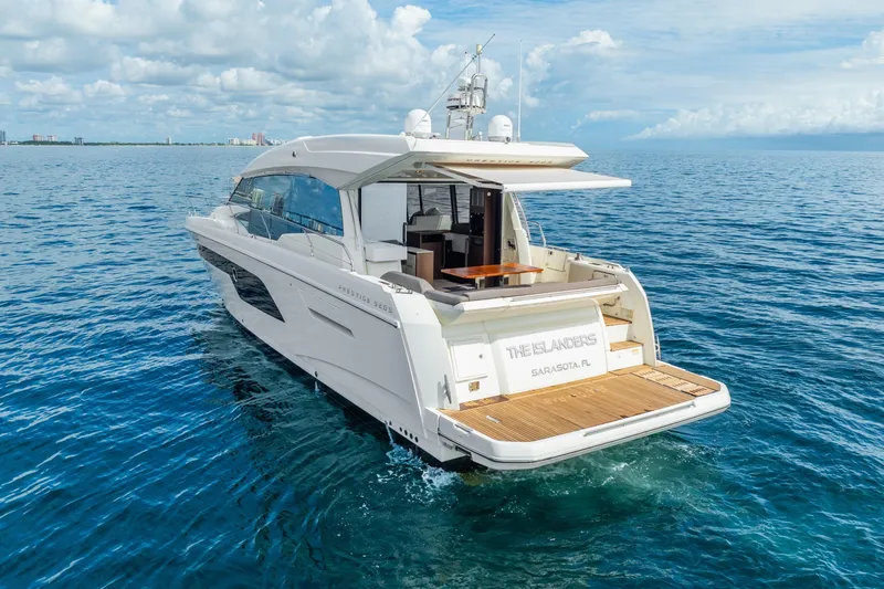  Yacht Photos Pics Luxury 2018 Prestige 520S yacht cruising on open sea under blue sky.