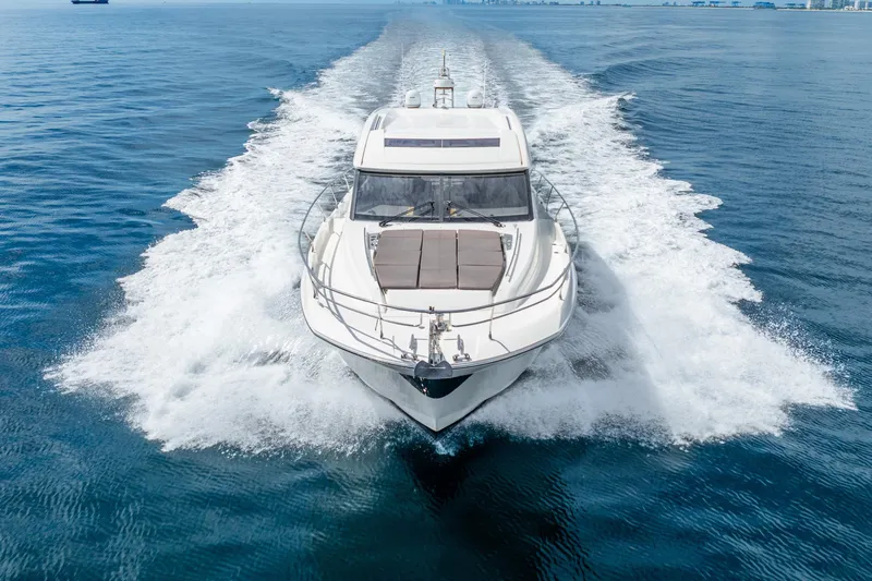  Yacht Photos Pics 2018 Prestige 520S yacht cruising on open water, creating a dynamic wake.