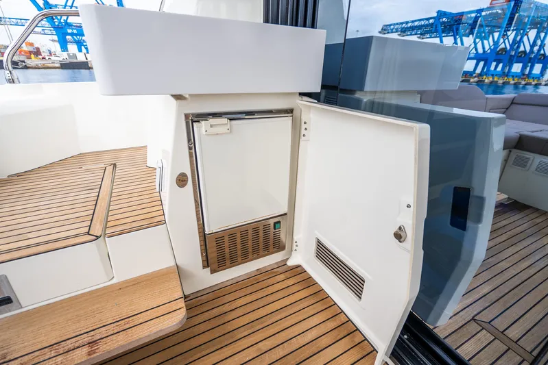  Yacht Photos Pics 2018 Prestige 520S yacht with open mini fridge on teak deck.