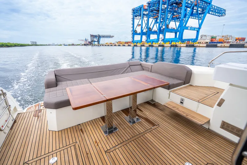  Yacht Photos Pics Luxury 2018 Prestige 520S yacht deck with seating, table, and ocean view.