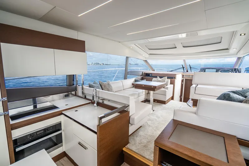  Yacht Photos Pics Luxurious interior of 2018 Prestige 520S yacht with modern kitchen and seating area.