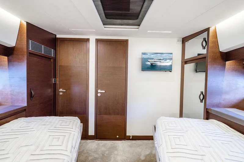  Yacht Photos Pics Luxurious 2018 Prestige 520S yacht cabin with twin beds and elegant wood finishes.