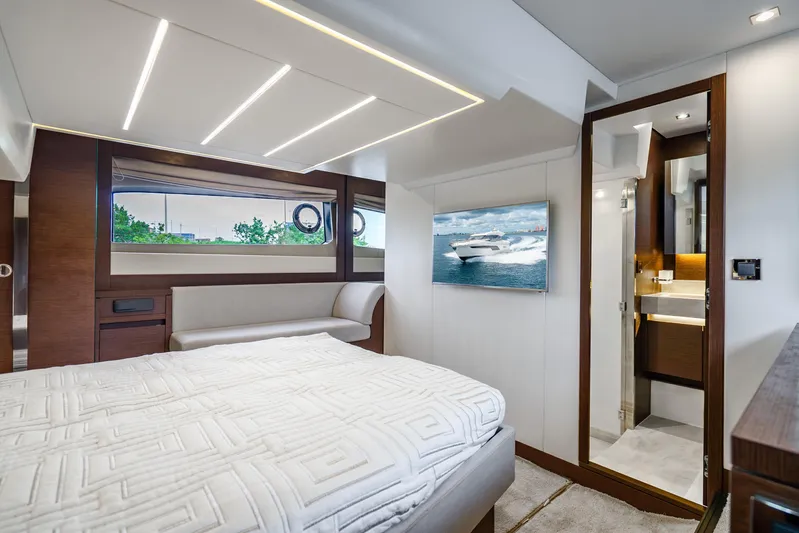  Yacht Photos Pics Luxurious interior of 2018 Prestige 520S yacht with modern bedroom and ensuite bathroom.