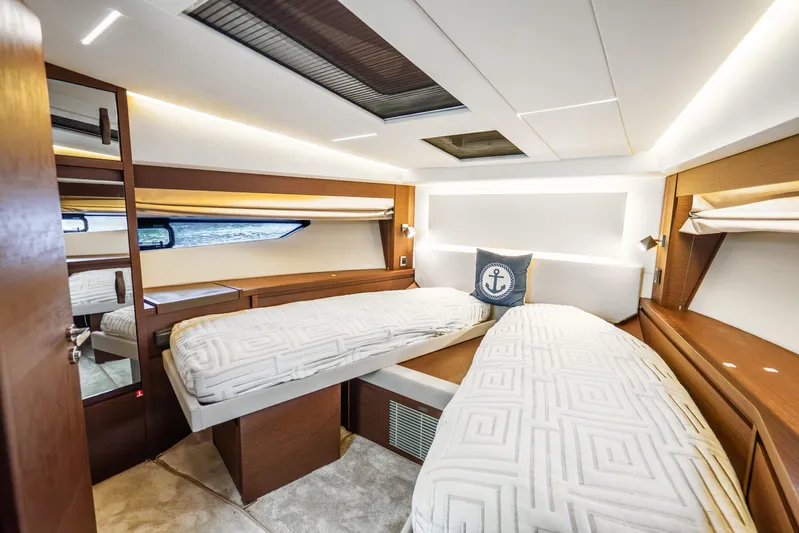 Yacht Photos Pics Luxurious cabin interior of 2018 Prestige 520S yacht with twin beds and nautical decor.