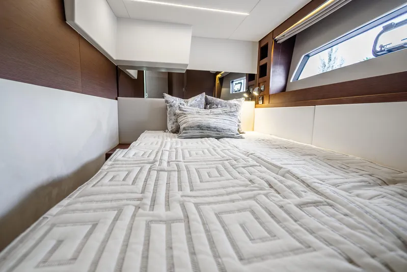  Yacht Photos Pics Luxurious cabin interior of 2018 Prestige 520S yacht with elegant bedding and modern design.