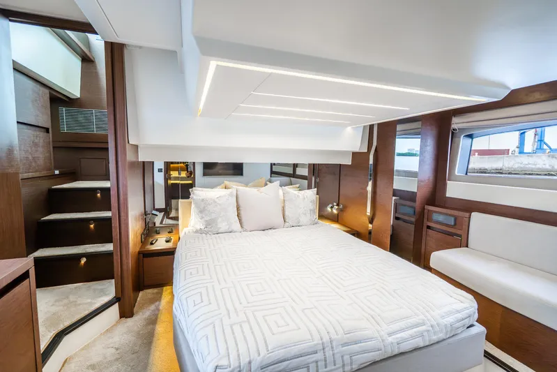  Yacht Photos Pics Luxurious bedroom interior of 2018 Prestige 520S yacht with modern design and elegant furnishings.